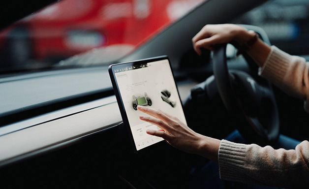 woman controlling car with a digital dashboard