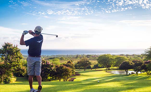 Golfer hit sweeping driver after hitting golf ball down the fairway