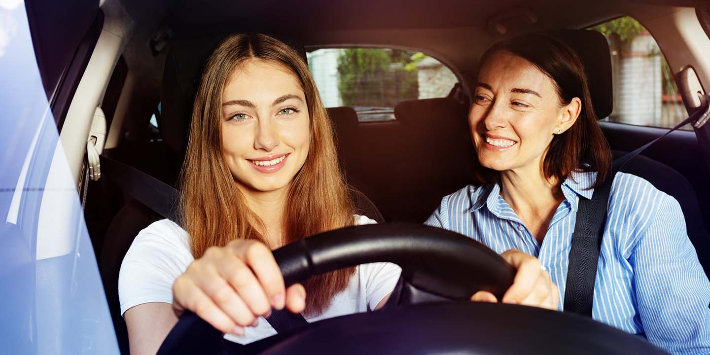 Mother teaching Daughter to drive