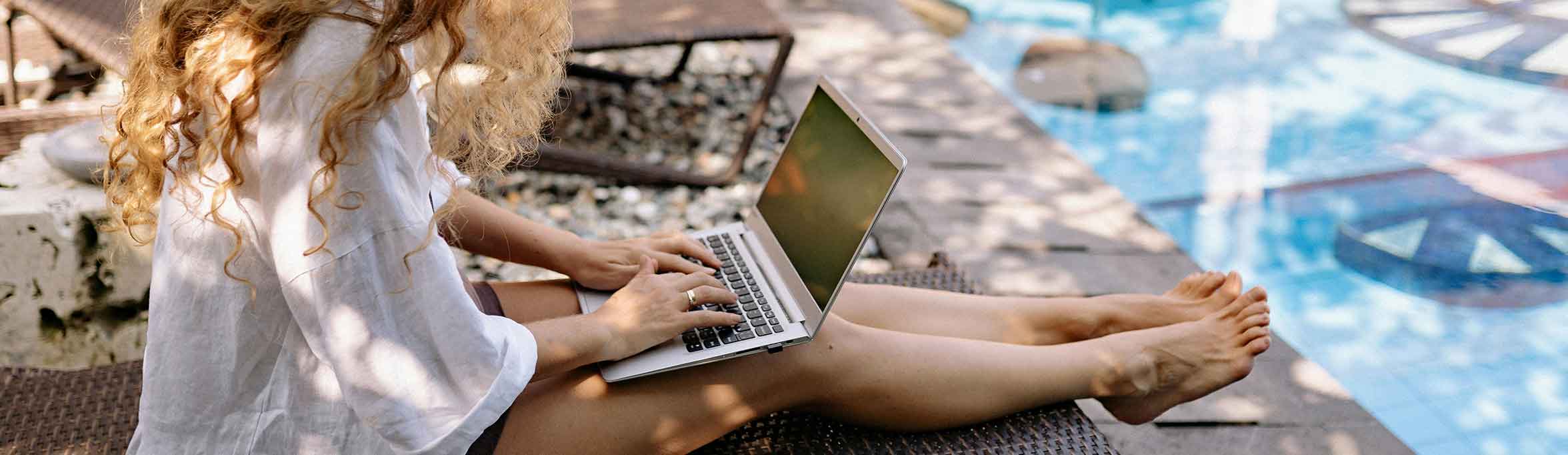 Woman working on laptop in the trip